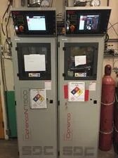 Two grey gas cabinets side by side