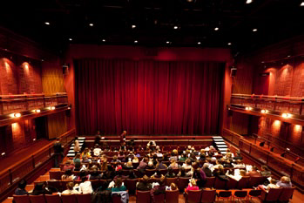 Inside of a theater with audience